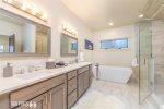 Master En Suite with double vanity, soaking tub, and walk-in shower